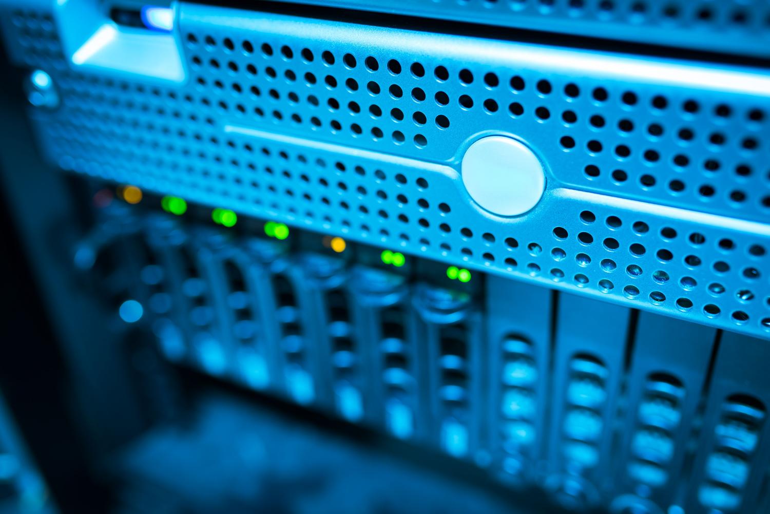 Modern server rack with status LEDs, representing the technical infrastructure pillar of enterprise security.