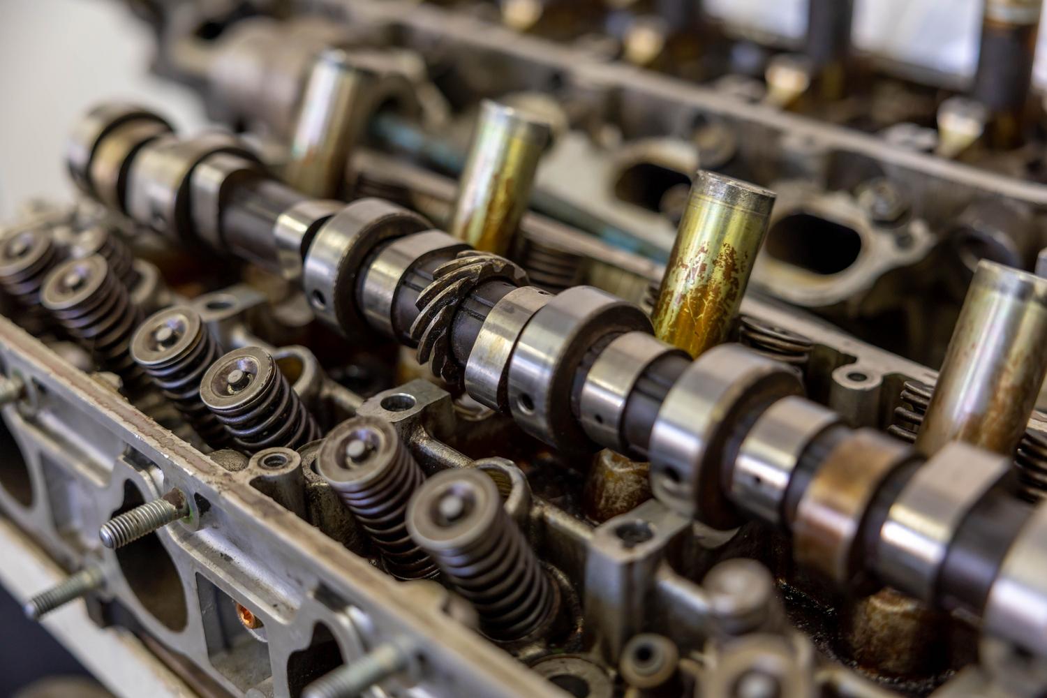 Detailed view of a car engine camshaft, the core component of the VVT system