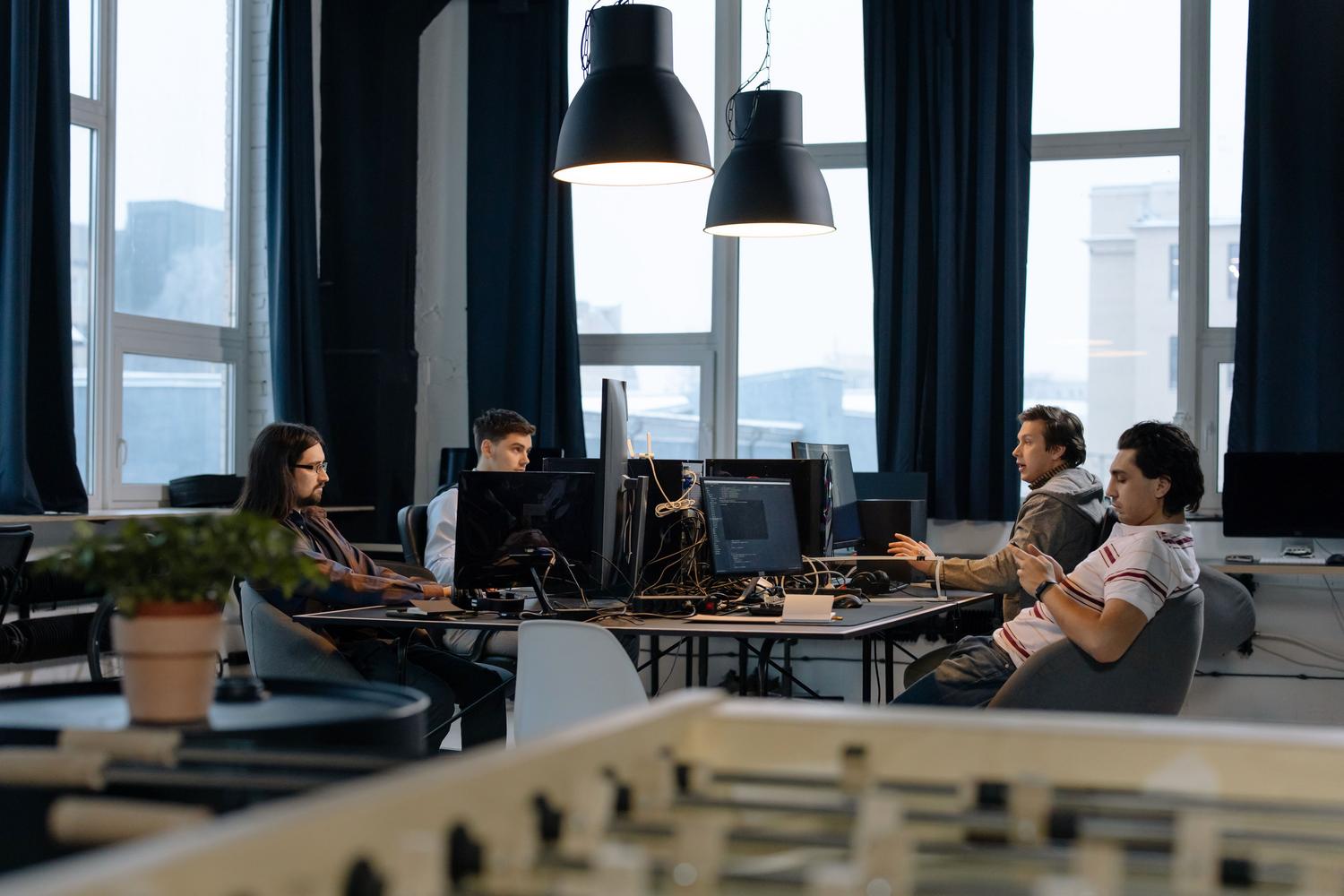Team of software engineers collaborating in a modern open-plan office.